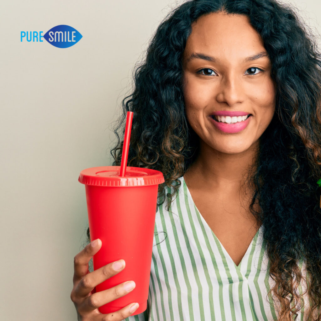 Woman holding a soda