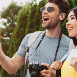 Smiling man and woman looking away