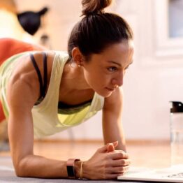 A 30-year-old woman working out at home